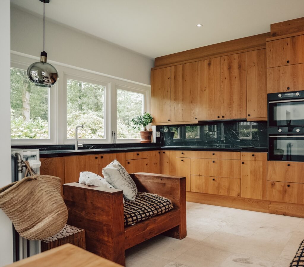 Cozy Scandic kitchen with wooden cabinet and minimalist and Mediterranean design.