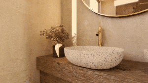 bathroom wabi sabi, with beautiful Terazzo sink on rough wood furniture